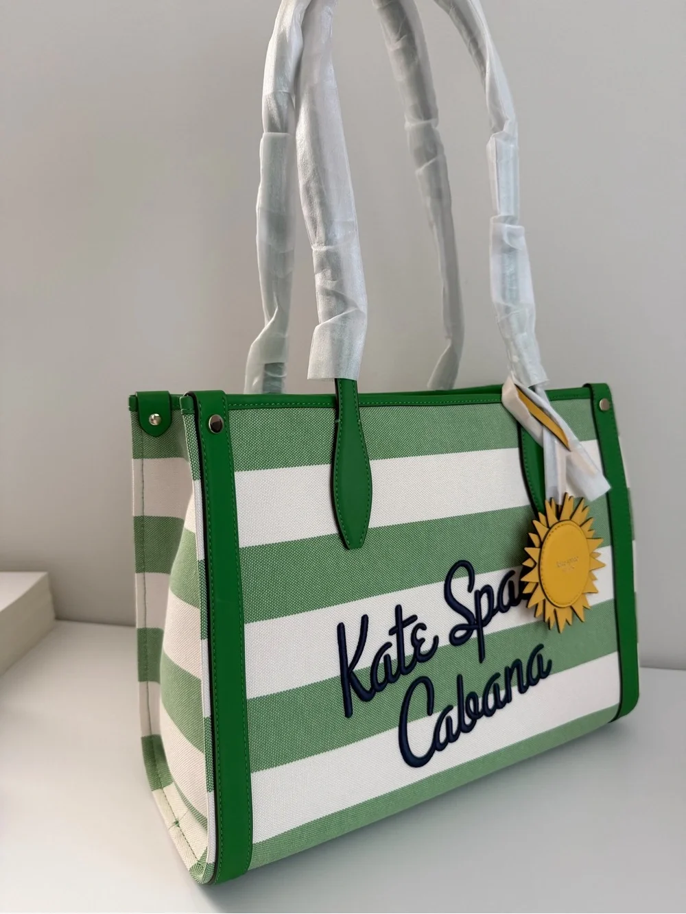 kate spade Green and White Striped Cabana Tote with Yellow Sun Charm